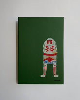 Green notebook with a graphic design of a character holding a British flag on a white background
