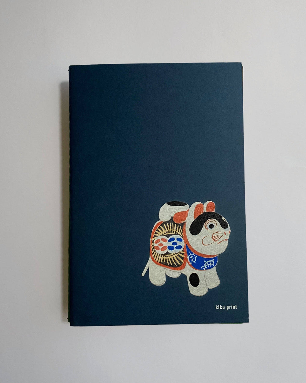 Notebook with a cartoon dog design on a blue background