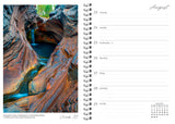 Calendar page with a rock formation and water feature on one side and a grid layout on the other.