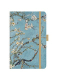 Notebook with floral design on a blue background