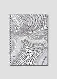 Notebook with black and white abstract pattern on a gray background