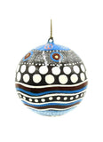 Decorative ornament with polka dot and striped pattern on a white background