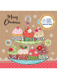 A festive Christmas-themed card or print featuring an illustrated two-tier cupcake stand with colorful cupcakes on a kraft brown background. The text 'Merry Christmas' appears on the left, and circular charity badges on the right mention Jeano for Kids and the Children's Medical Institute.