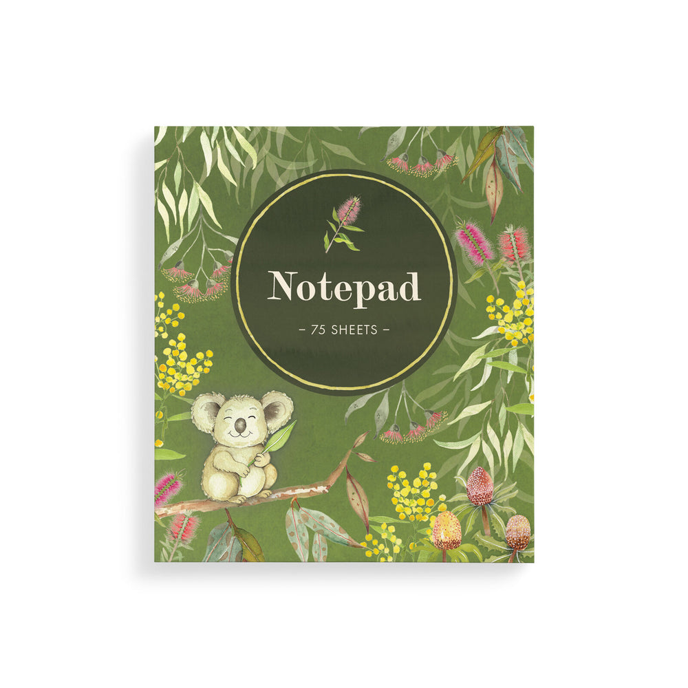 A small square notepad with a smiling koala sitting in a tree on a green background