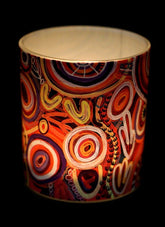 Colorful cylindrical container with abstract patterns on a black background
