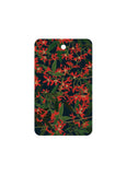 Rectangular card with red floral pattern on a dark background