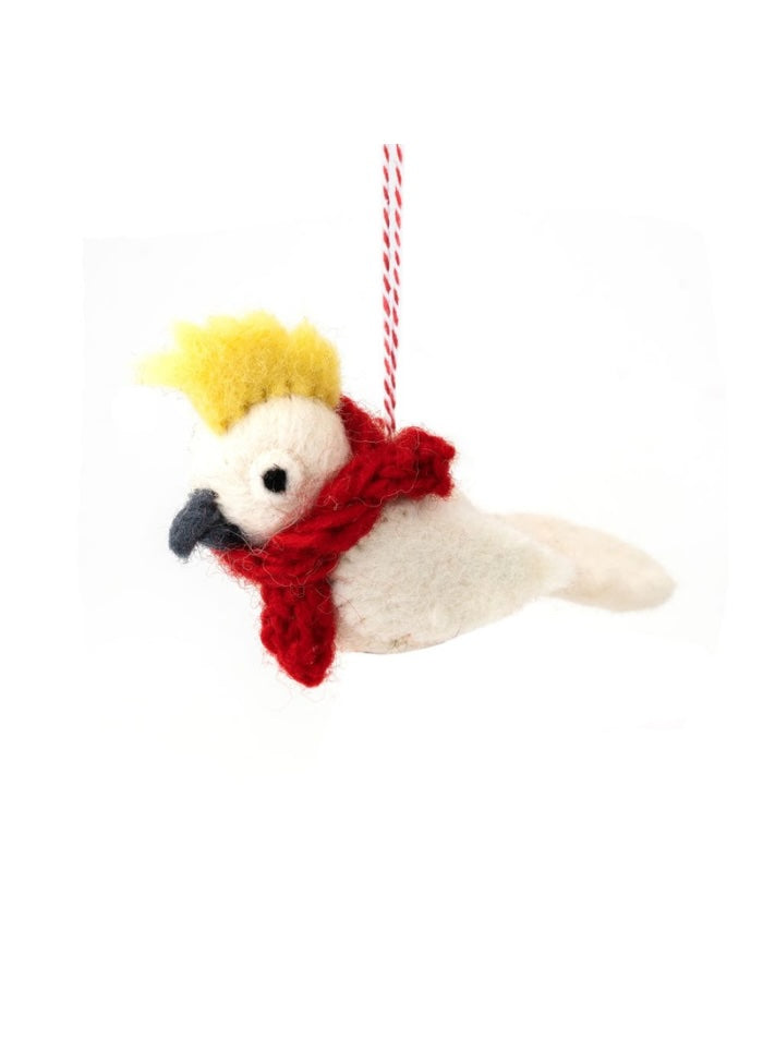 Decorative parrot ornament with a red scarf and yellow top hat on a white background