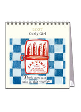 2027 Curly Girl desk calendar with sardine can illustration on a checkered background