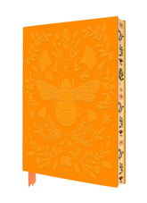 Orange notebook with bee and floral design on a white background