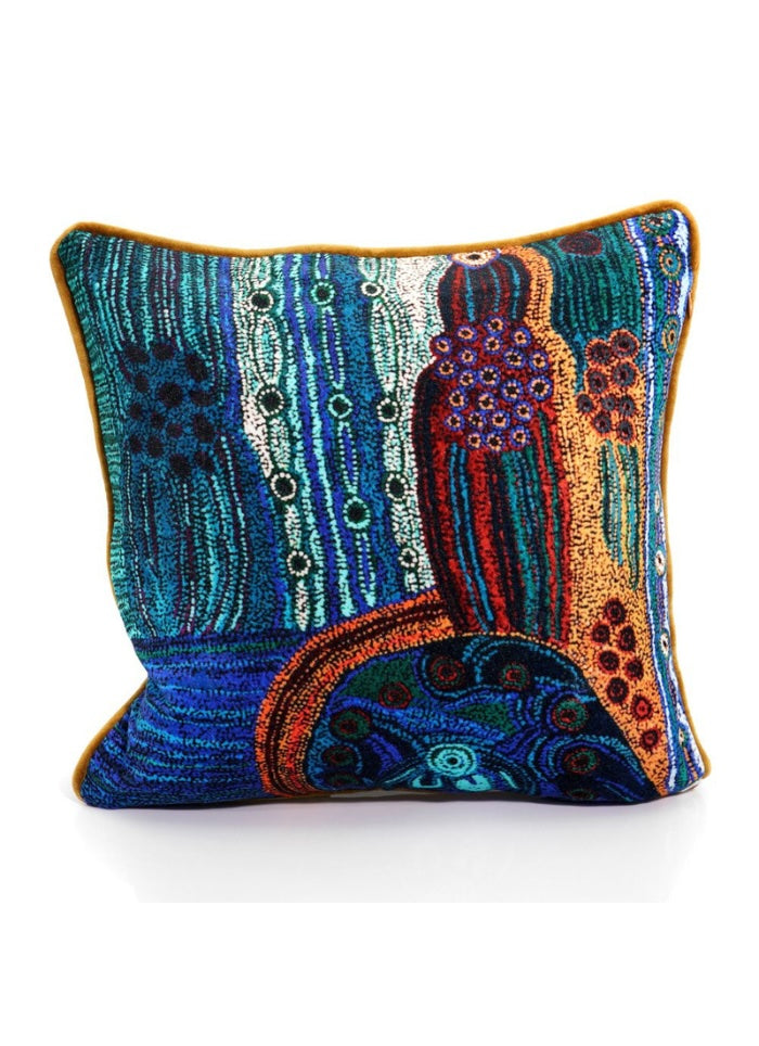 Colorful embroidered pillow with intricate patterns on a white background