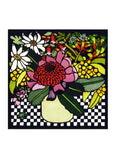 A square card with a cream vase full of Australian native flowers including a waratah on a black and white check tablecloth