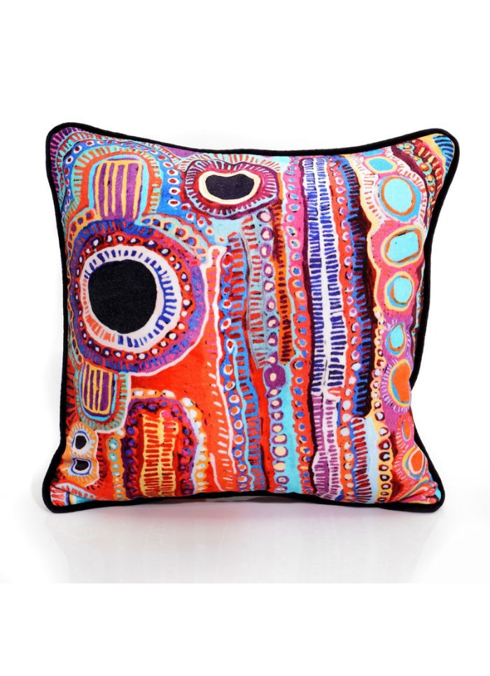 Colorful decorative pillow with abstract pattern on a white background