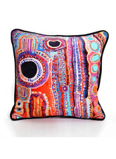 Colorful decorative pillow with abstract pattern on a white background