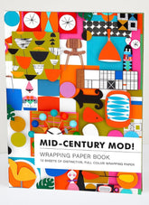 Colorful wrapping paper book with mid-century modern design on a white background