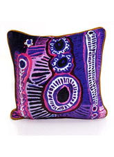 Decorative pillow with a colorful abstract pattern on a white background
