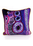 Decorative pillow with a colorful abstract pattern on a white background