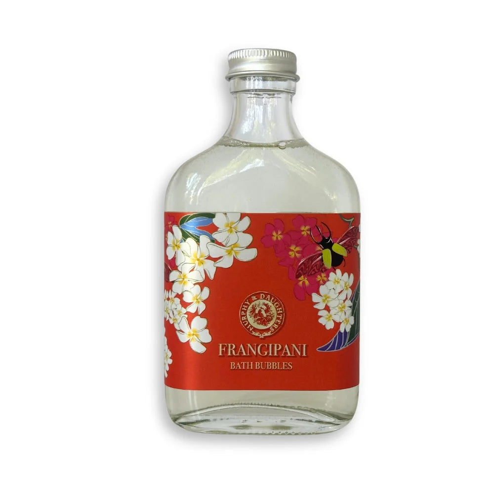 A glass bottle with a red label. Murphy & Daughters Frangipani Bath Bubbles