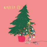 Illustration of a decorated Christmas tree with 'NAILED IT' text on a pink background