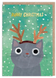 Green Christmas card with reindeer antlers on a grey cat