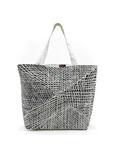 A canvas tote bag produced by Better World Arts and based on artwork by Paulina Puruntatameri.