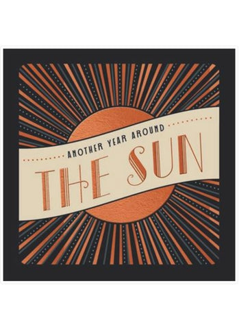Decorative card with sun design and text 'Another Year Around The Sun' on a black background