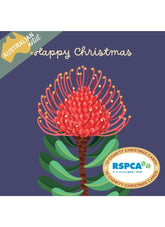 A Christmas-themed card design with a large red and green floral illustration on a dark blue background, plus the words 'Happy Christmas' and an 'Australian Artist' badge. An RSPCA logo appears in a circular badge at the lower right.
