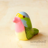Pink, green and yellow Songbird Princess Parrot paperweight