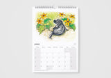 Calendar with a raccoon illustration and floral design on a white background