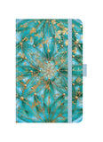 Notebook with teal and gold floral design on a white background