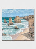 Scenic view of a beach with rock formations and ocean waves.