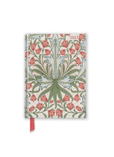 Floral patterned notebook with a red ribbon on a white background