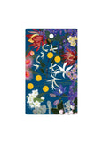Floral design on a blue background with colorful flowers and leaves.