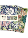 Set of three mini notebooks with floral design packaging on a white background