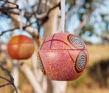Debbie Brown Christmas bauble hanging on a tree outside in the Australian bush.