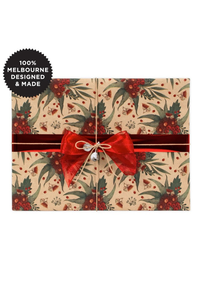 Gift box with floral pattern and red ribbon on a white background, featuring '100% Melbourne Designed & Made' label.