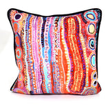 Colorful patterned pillow with a white background
