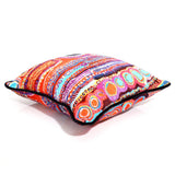 Colorful patterned pillow on a white background