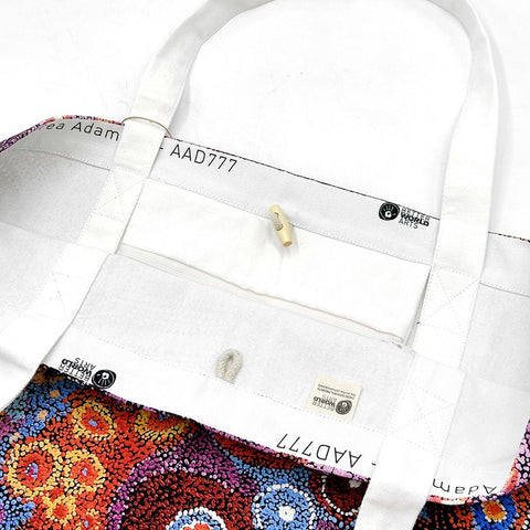 Interior of a canvas tote bag from Better World Arts and based on artwork by Andrea Mimpitja Adamson.