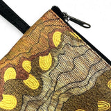 Embroidered pouch with a turtle design on a white background
