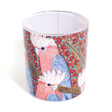 Cup with a colorful parrot design on a white background