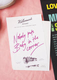 Notebook with 'Nobody puts Baby in the Baby corner' text on a pink surface