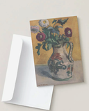 Greeting card with floral design and envelope on a light background