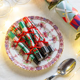 Mini Saucer crackers. Green and red Nutcracker on a plate.