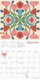 Calendar page for September with a colorful floral design on a beige background
