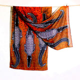 An organic cotton scarf with artwork by Edward Malati Yunupingu.