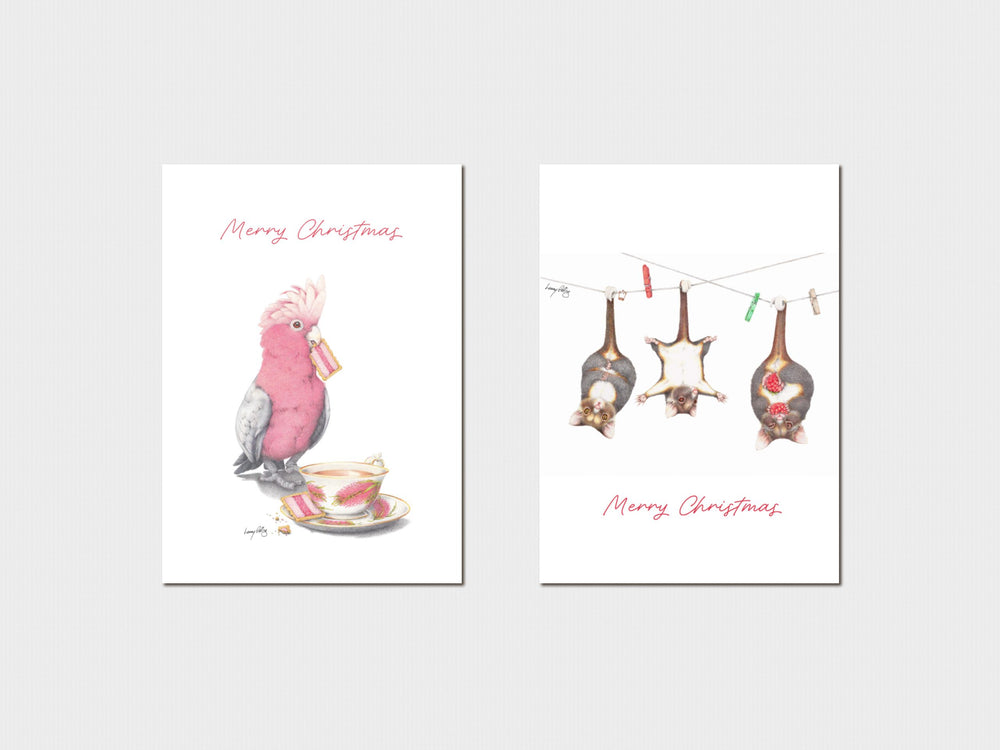 Two Christmas-themed cards with a pink cockatoo and hanging decorations on a white background.