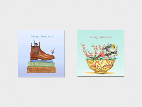 Two Christmas-themed greeting cards with boots and a bowl of flowers on a light blue background.