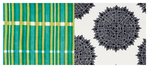 Textile with green and yellow checkered pattern and black mandala design on a white background