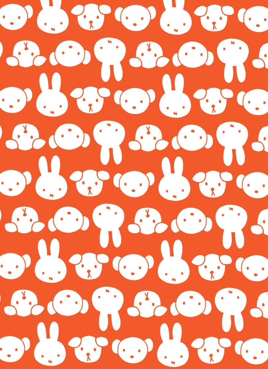 Pattern of white animal faces on an orange background