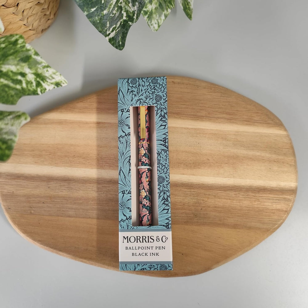 Morris & Co ballpoint pen set in packaging on a wooden surface with plants in the background